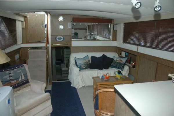 Slide: The Image of Interior of 1969 Chris-Craft 47 Commander yacht with cozy seating and nautical decor. - 15