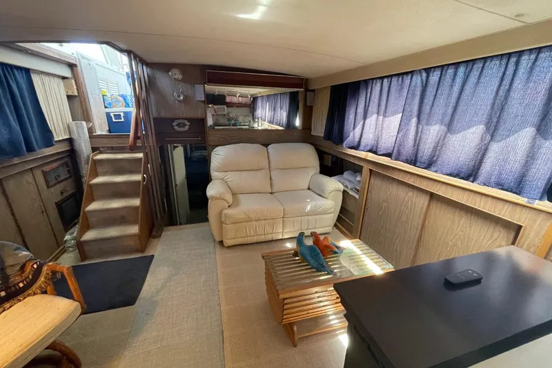 Slide: The Image of Interior of 1969 Chris-Craft 47 Commander yacht with cozy seating and nautical decor. - 18