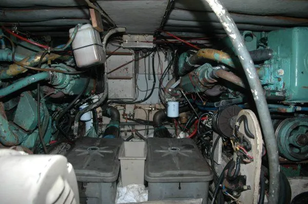 Slide: The Image of Engine room of 1969 Chris-Craft 47 Commander, showcasing dual engines and mechanical components. - 39