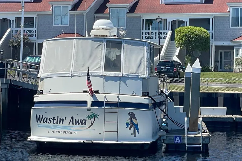 Slide: The Image of 1969 Chris-Craft 47 Commander docked, named "Wastin' Awa," Myrtle Beach, SC. - 4