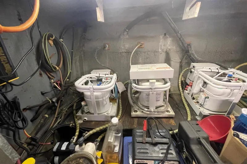 Slide: The Image of Engine room of 1969 Chris-Craft 47 Commander with mechanical equipment and wiring. - 42