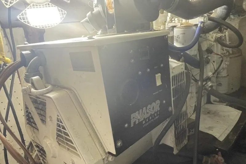 Slide: The Image of Engine room of a 1969 Chris-Craft 47 Commander with visible machinery and lighting. - 44