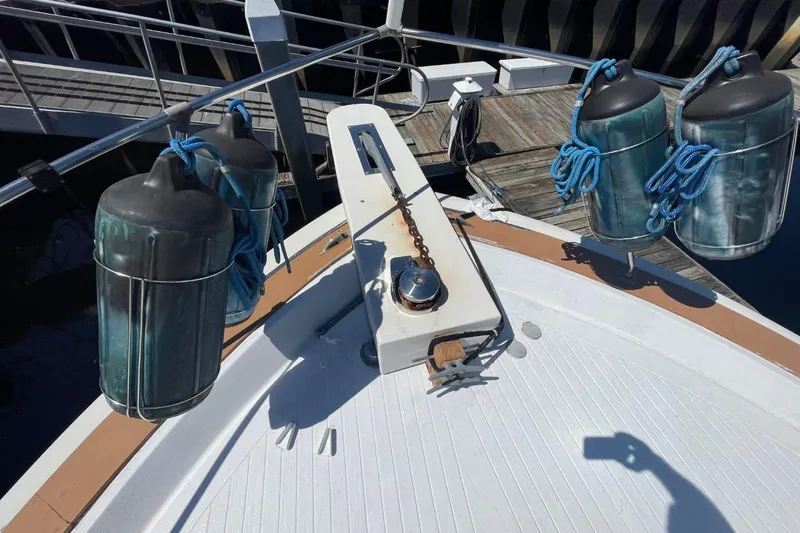 Slide: The Image of Bow of 1969 Chris-Craft 47 Commander with fenders and anchor chain. - 49