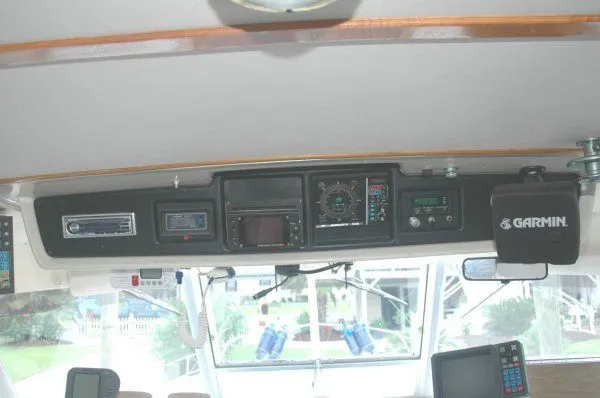 Slide: The Image of 1969 Chris-Craft 47 Commander helm with Garmin navigation equipment and control panel. - 8