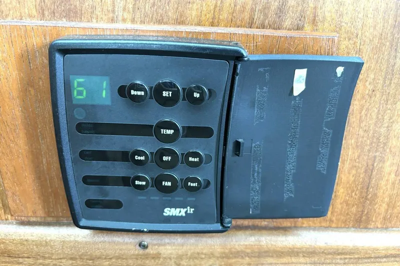 Slide: The Image of SMXir control panel on 1972 Hatteras 43DC yacht, displaying temperature settings. - 41