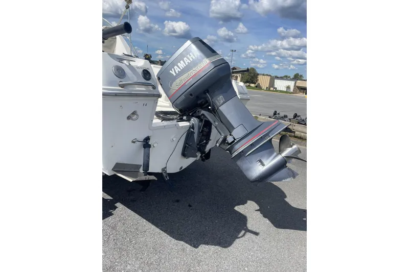 Slide: The Image of 2002 Wellcraft 24 Walkaround with Yamaha outboard motor in parking lot. - 3