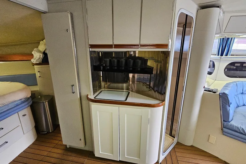 Slide: The Image of Interior of 1990 Carver 3467 Santego yacht with kitchenette and seating area. - 24