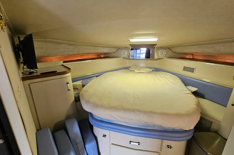 Slide: The Image of Interior cabin of 1990 Carver 3467 Santego yacht with cozy bed and TV. - 26