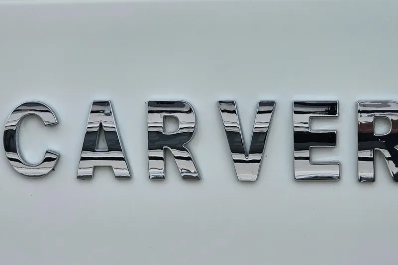 Slide: The Image of Chrome "Carver" emblem on 1990 Carver 3467 Santego boat. - 30