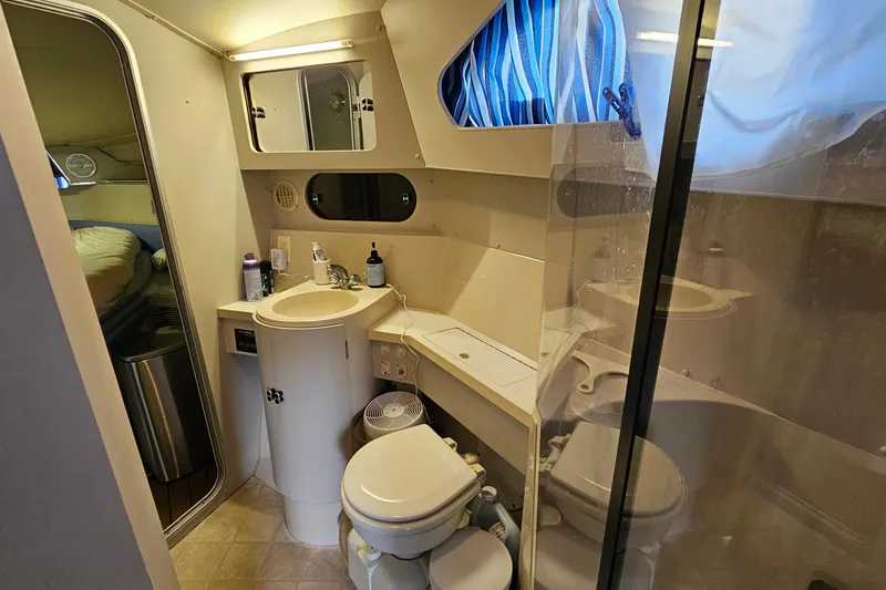 Slide: The Image of Bathroom interior of 1990 Carver 3467 Santego yacht with sink, toilet, and mirror. - 28