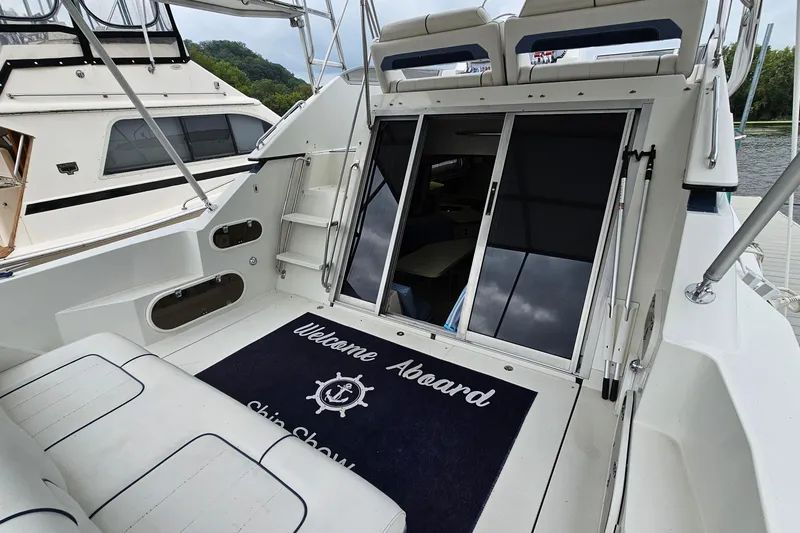 Slide: The Image of 1990 Carver 3467 Santego yacht deck with welcome mat and seating area. - 7