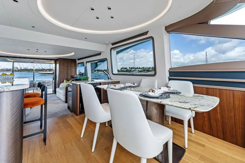 Slide: The Image of Luxurious interior of 2025 Aquitalia 78 Fly yacht with elegant dining area and scenic views. - 10