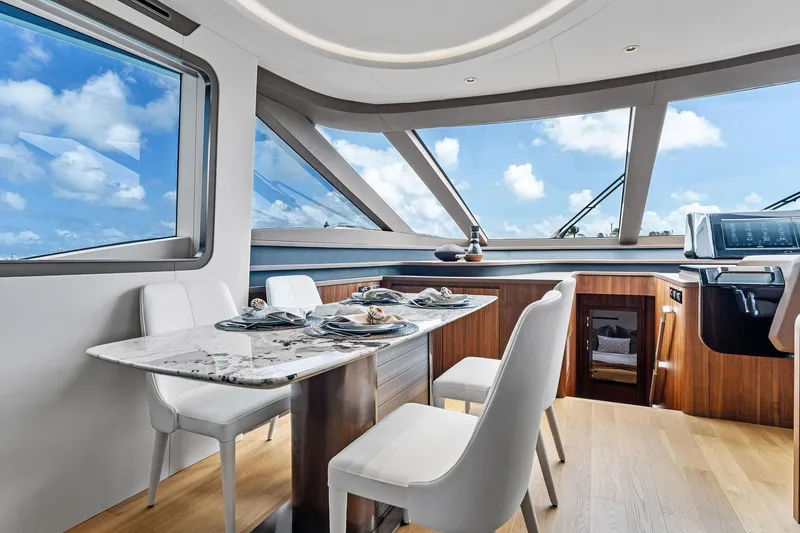 Slide: The Image of Luxurious interior of 2025 Aquitalia 78 Fly yacht with elegant dining area. - 11