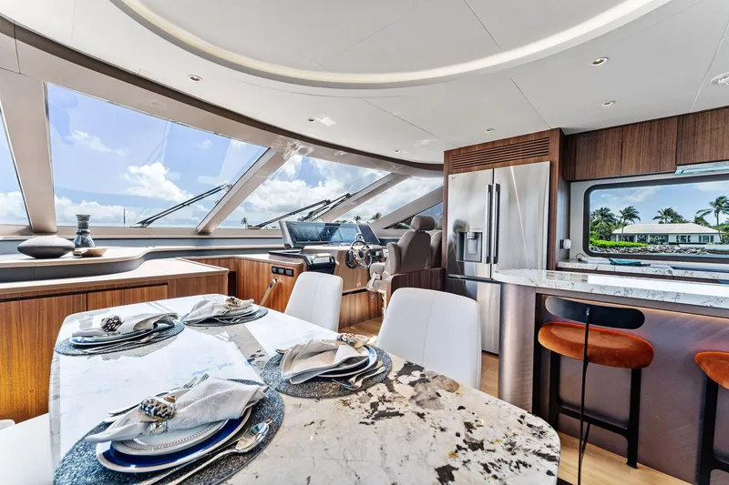 Slide: The Image of Luxurious interior of 2025 Aquitalia 78 Fly yacht with elegant dining and modern kitchen. - 12