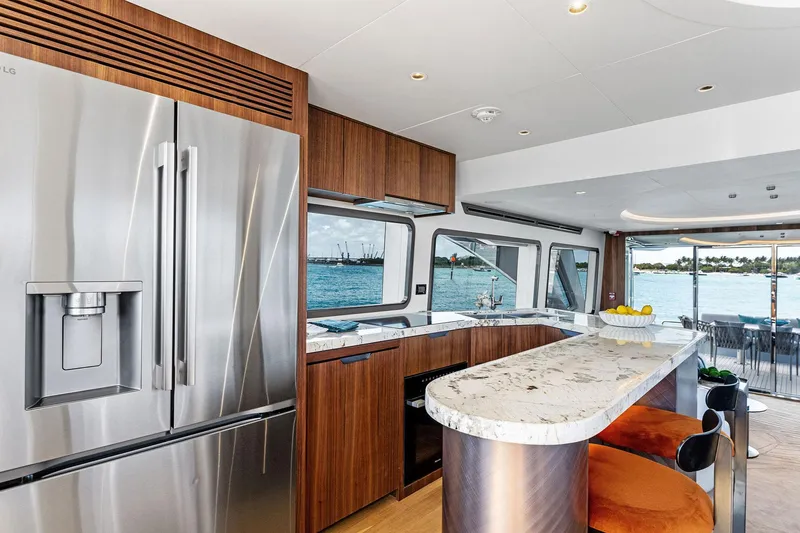 Slide: The Image of Luxurious 2025 Aquitalia 78 Fly yacht interior with modern kitchen and ocean view. - 14