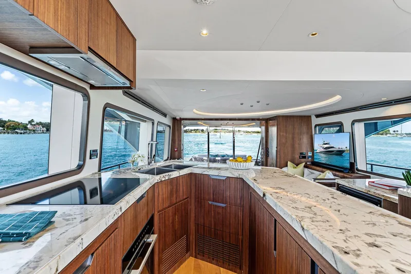 Slide: The Image of Luxurious interior of 2025 Aquitalia 78 Fly yacht with modern kitchen and scenic ocean views. - 16