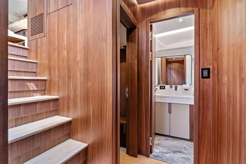 Slide: The Image of Interior of 2025 Aquitalia 78 Fly yacht, featuring wooden stairs and modern bathroom. - 38