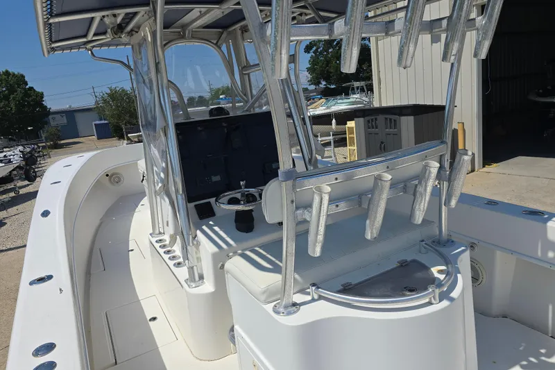 Slide: The Image of 2007 Competition 31 boat interior with seating, parked near other vehicles and boats. - 17