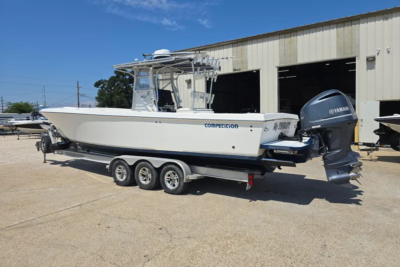 Slide: The Image of Open storage compartment on a 2007 Competition 31 boat, showcasing spacious interior. - 18