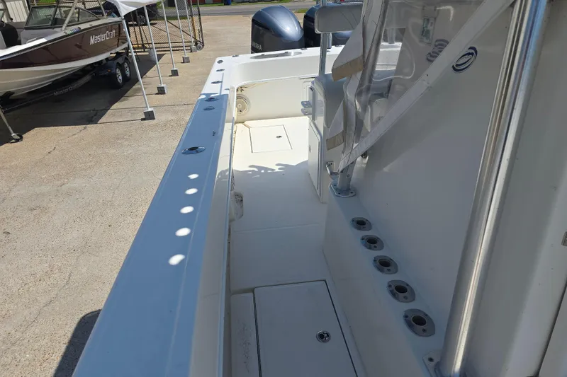 Slide: The Image of 2007 Competition 31 boat interior with rod holders and seating area. - 22