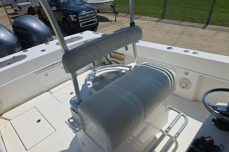 Slide: The Image of 2007 Competition 31 boat interior with seating and dual outboard engines. - 23