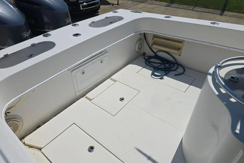 Slide: The Image of 2007 Competition 31 boat deck with storage compartments and coiled rope. - 25