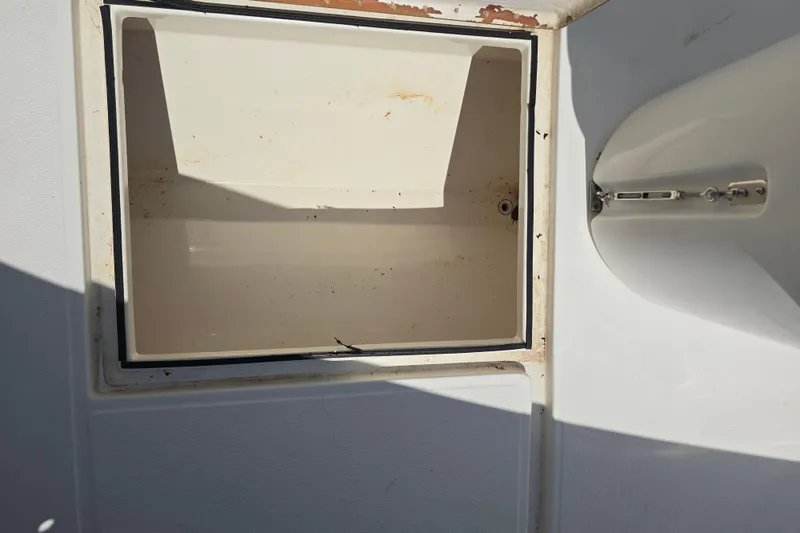 Slide: The Image of 2007 Competition 31 boat with radar equipment and seating, docked in a sunny area. - 9