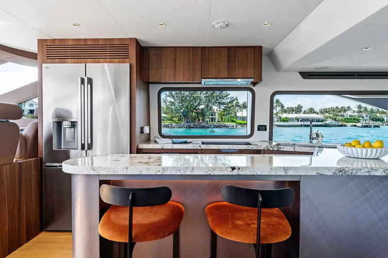 Slide: The Image of Luxurious 2024 Aquitalia 78 Fly yacht kitchen with modern design and waterfront view. - 17