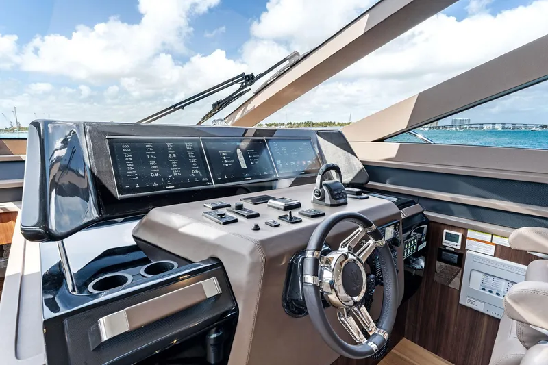 Slide: The Image of 2024 Aquitalia 78 Fly yacht cockpit with modern controls and steering wheel. - 24