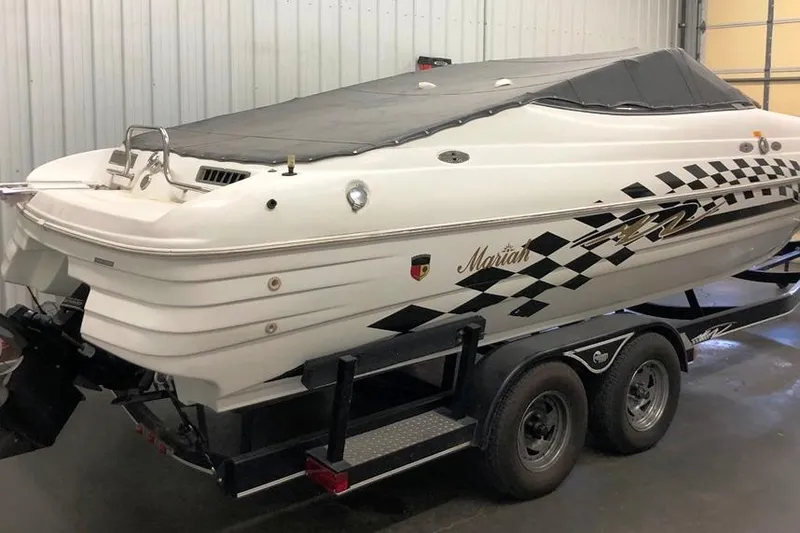 Slide: The Image of 1999 Mariah Shabah Z250 Cuddy Cabin boat on trailer in indoor storage. - 25