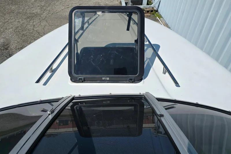 Slide: The Image of 1999 Mariah Shabah Z250 Cuddy Cabin boat deck with open hatch. - 10