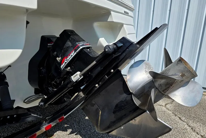 Slide: The Image of 1999 Mariah Shabah Z250 Cuddy Cabin boat with MerCruiser Bravo engine and propeller detail. - 12