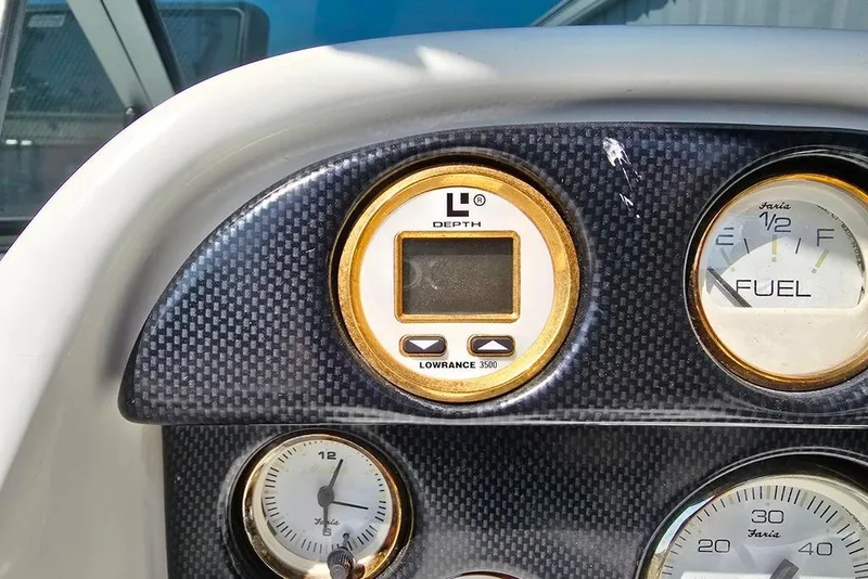 Slide: The Image of Dashboard of 1999 Mariah Shabah Z250 Cuddy Cabin with depth and fuel gauges. - 19