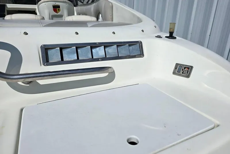Slide: The Image of 1999 Mariah Shabah Z250 Cuddy Cabin boat dashboard with control panel and seating. - 22