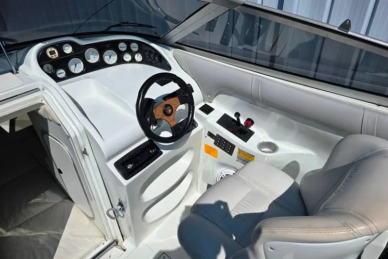 Slide: The Image of 1999 Mariah Shabah Z250 Cuddy Cabin boat interior with steering wheel and control panel. - 3