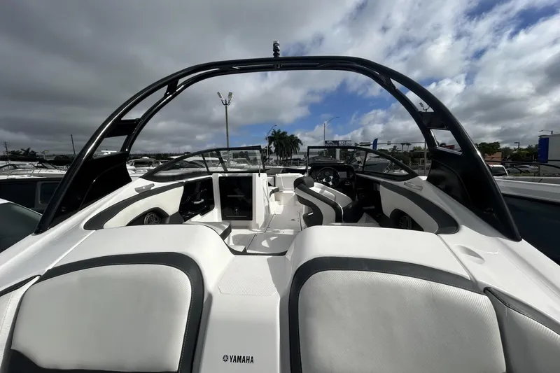 Slide: The Image of 2017 Yamaha Boats 212X interior with sleek seating and modern design. - 7