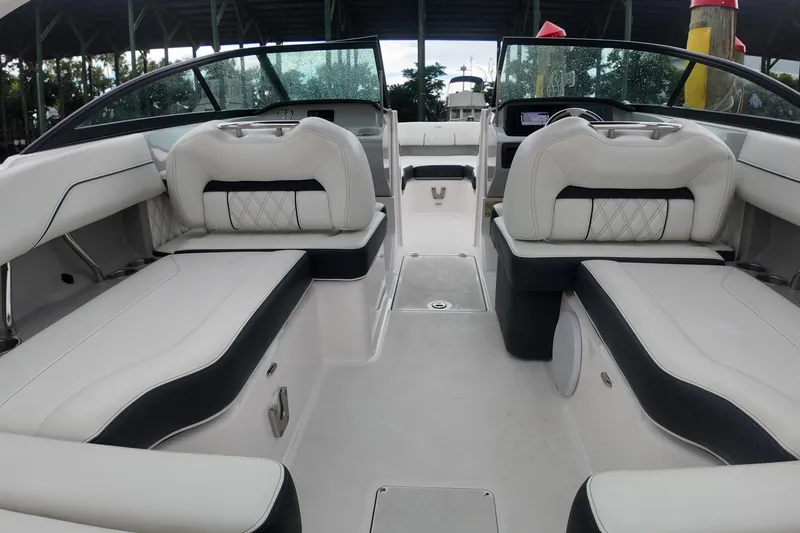 Slide: The Image of Interior of a 2021 Regal LX2 boat with luxurious white seating. - 15