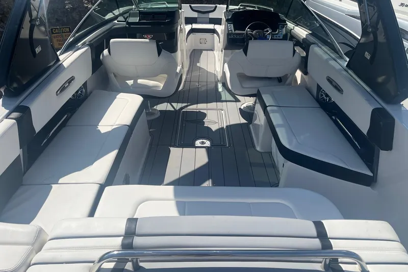 Slide: The Image of 2022 Chaparral 307 SSX boat interior with luxurious seating and modern design. - 10