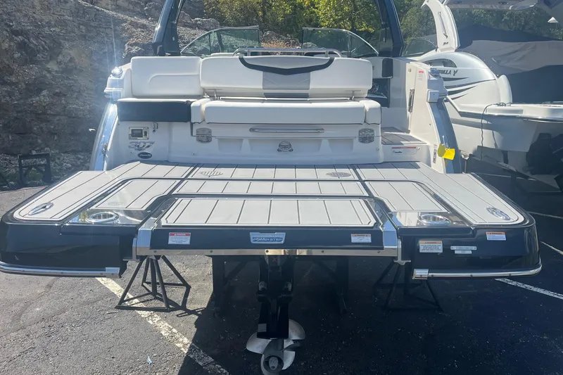 Slide: The Image of 2022 Chaparral 307 SSX boat with extended swim platform and seating area. - 11