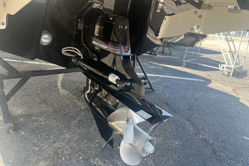 Slide: The Image of 2022 Chaparral 307 SSX boat with MerCruiser outdrive on a trailer. - 14