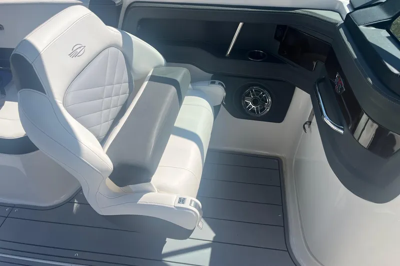 Slide: The Image of 2022 Chaparral 307 SSX boat interior with luxurious seating and modern design. - 5