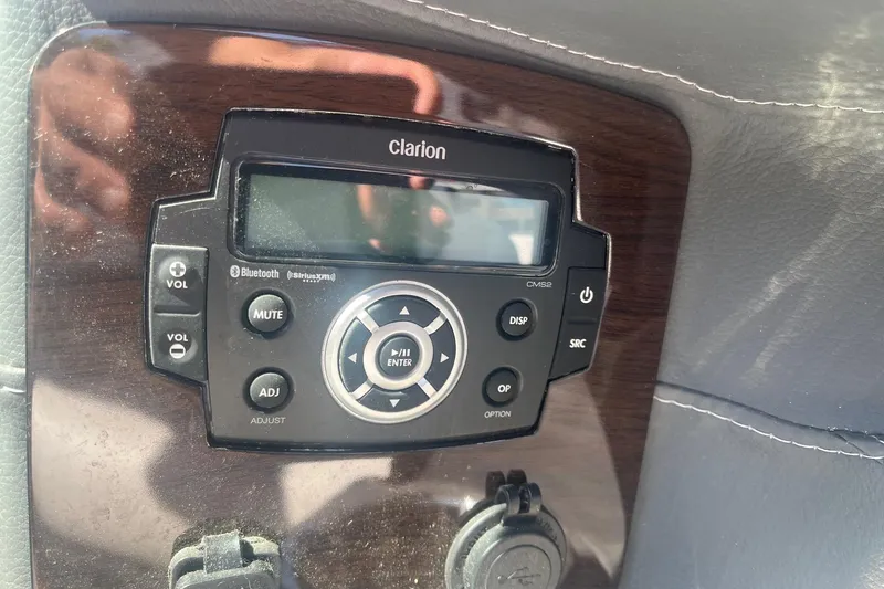 Slide: The Image of Clarion audio system in 2022 Chaparral 307 SSX boat dashboard. - 9