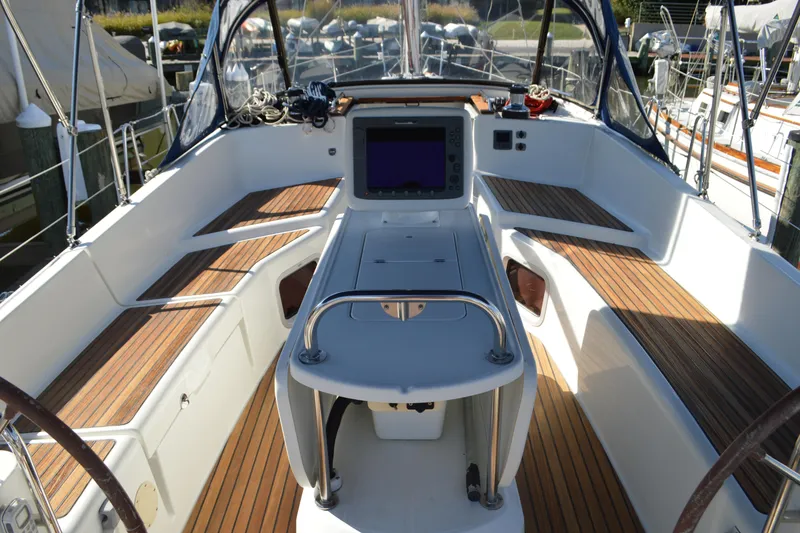 Slide: The Image of 2008 Jeanneau Sun Odyssey 45 DS cockpit with teak seating and navigation equipment. - 11