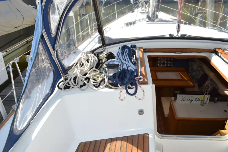 Slide: The Image of 2008 Jeanneau Sun Odyssey 45 DS sailboat deck with ropes and cabin entrance. - 17