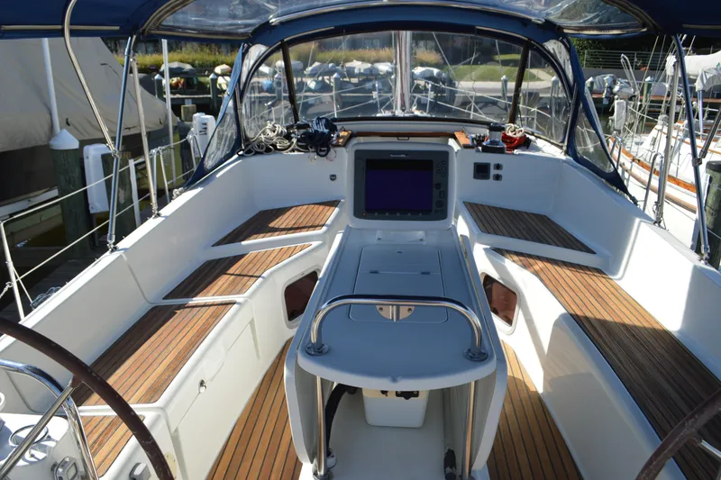 Slide: The Image of 2008 Jeanneau Sun Odyssey 45 DS cockpit with navigation equipment and teak seating. - 18