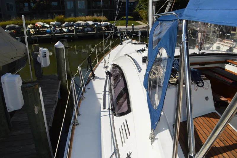 Slide: The Image of 2008 Jeanneau Sun Odyssey 45 DS sailboat docked at marina, showcasing deck and cockpit. - 20
