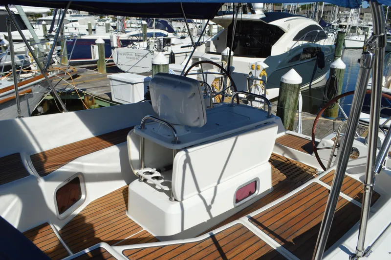 Slide: The Image of Cockpit of 2008 Jeanneau Sun Odyssey 45 DS sailboat with wooden deck and dual steering wheels. - 21