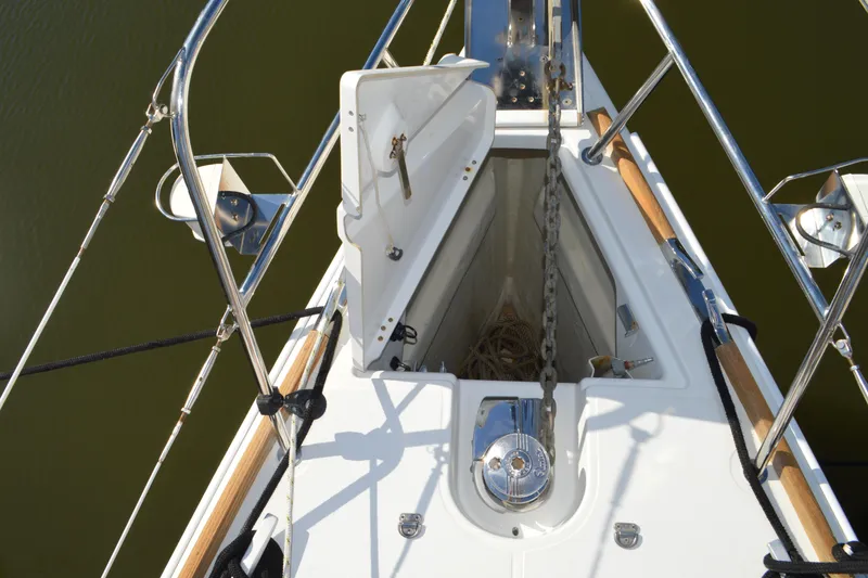 Slide: The Image of Bow of 2008 Jeanneau Sun Odyssey 45 DS sailboat with anchor chain and open hatch. - 26