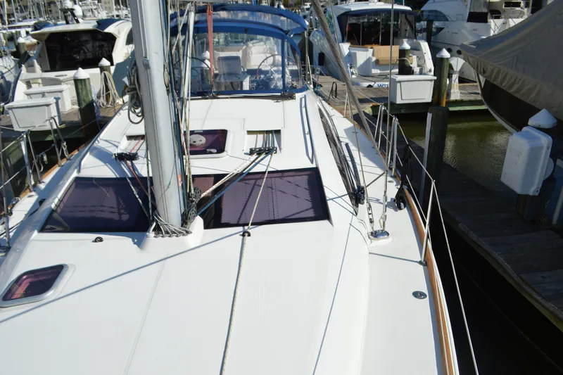 Slide: The Image of 2008 Jeanneau Sun Odyssey 45 DS sailboat docked at marina, showcasing deck and rigging. - 27