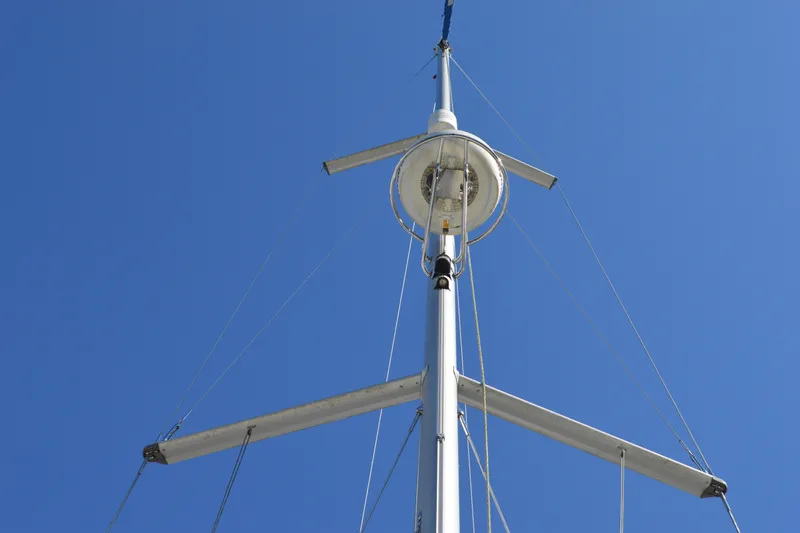 Slide: The Image of Mast of 2008 Jeanneau Sun Odyssey 45 DS sailboat against clear blue sky. - 30